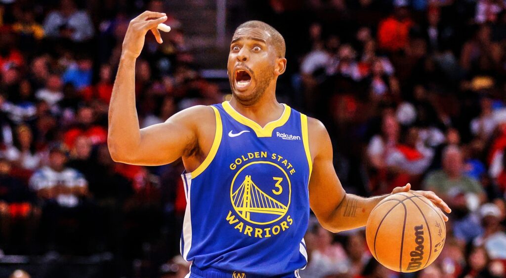 Chris Paul of Golden State Warriors dribbling with ball.