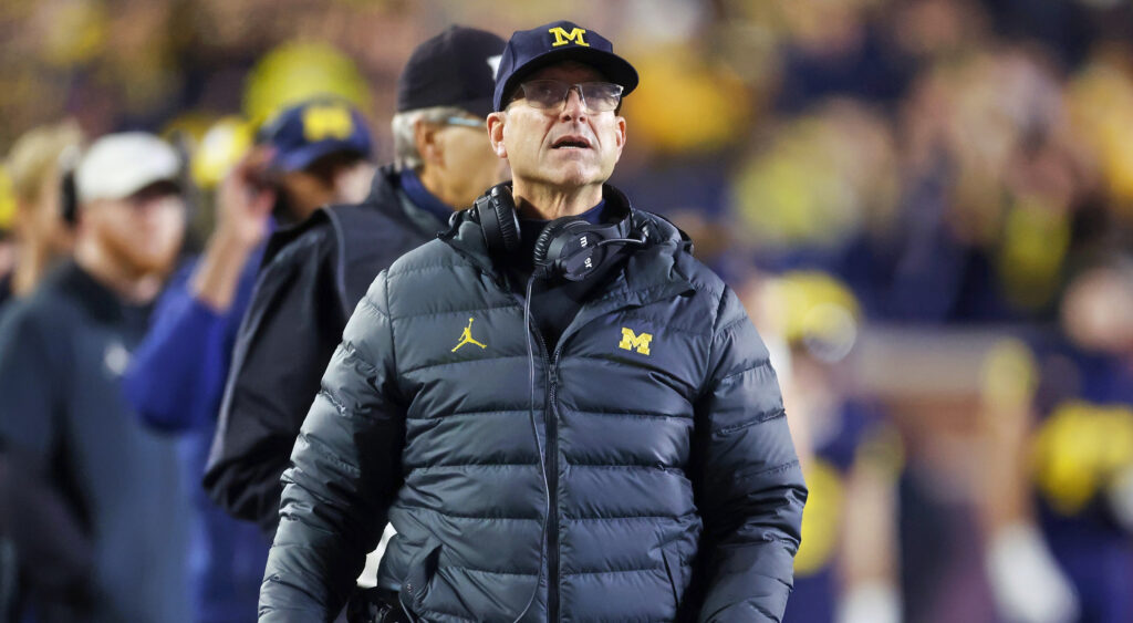 Jim Harbaugh in Michigan hat and jacket