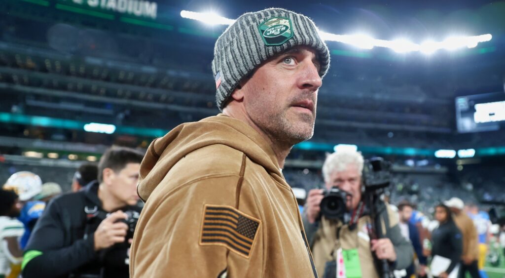 Aaron Rodgers in Jets gear and hoodie
