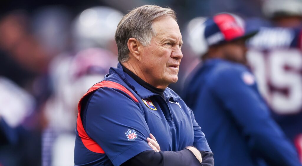 Bill Belichick on sidelines with arms folded