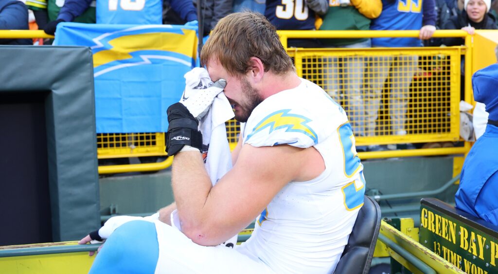 Joey Bosa of Los Angeles Chargers reacting as he's being carted away.