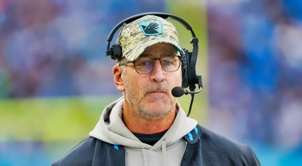 Carolina Panthers head coach Frank Reich looking on.