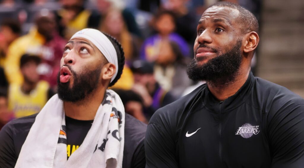 Anthony Davis (left) and LeBron James (right) looking on during game.