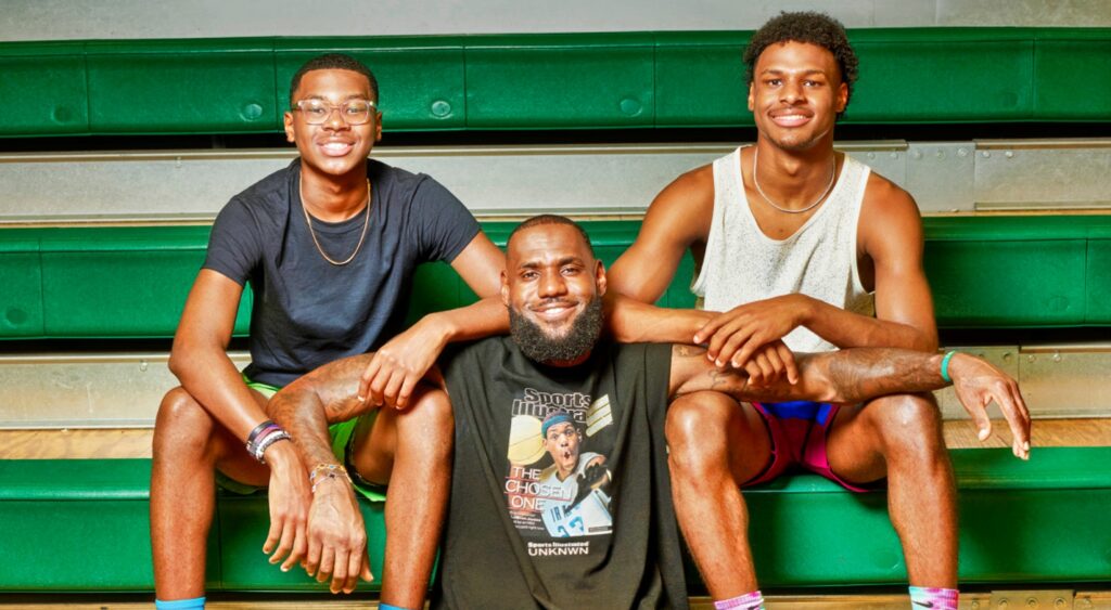 LeBron James sitting between sons Bryce and Bronny James