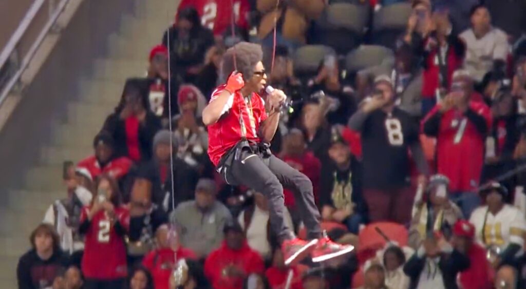 Ludacris drops from roof during halftime show.