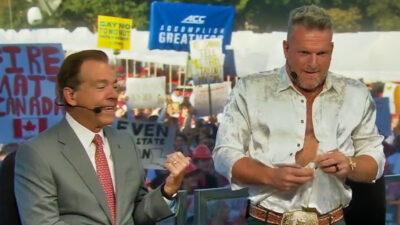 Pat McAfee unbuttoning his shirt on College GameDay