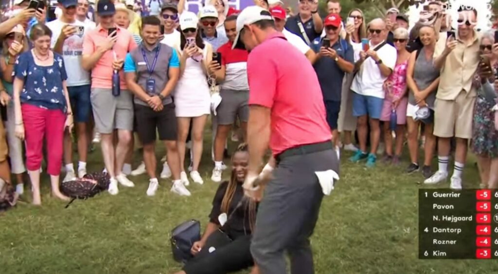 Rory McIlroy and fan on grass
