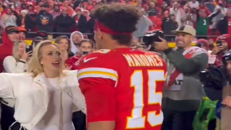 Brittany Mahomes (left) speaking to husband Patrick Mahomes (right).
