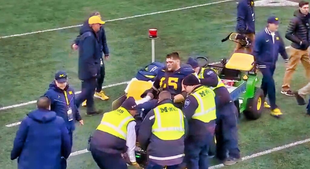 Michigan center Zak Kinter getting carted off during game vs. Ohio State.