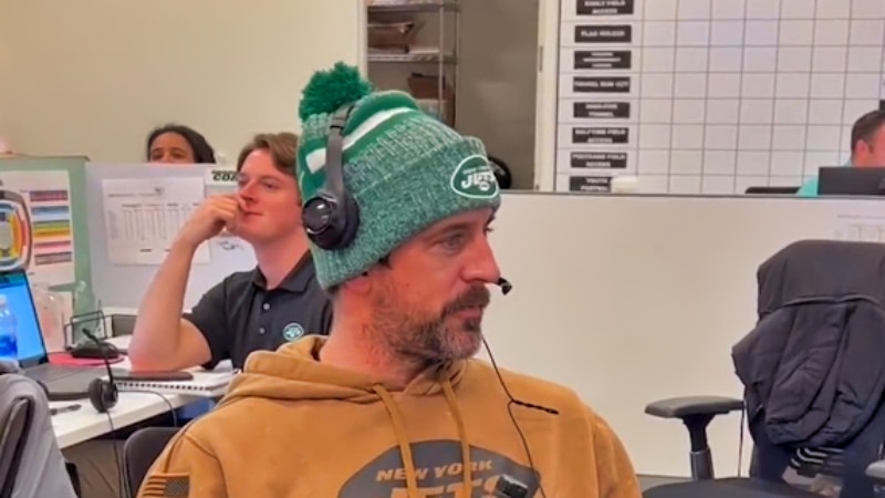 New York Jets quarterback Aaron Rodgers working as a ticket sales rep.