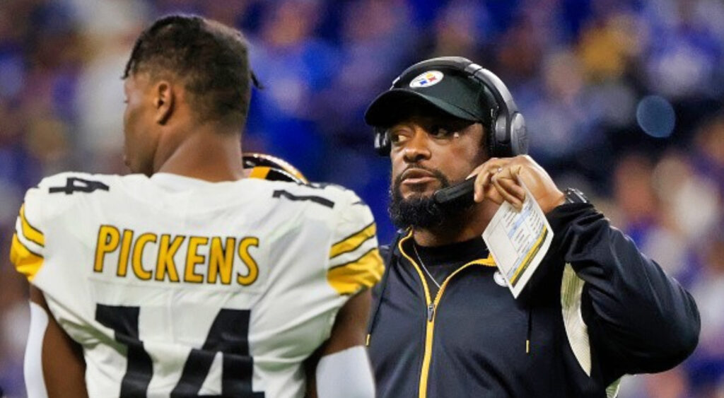 Mike Tomlin standing in front of George Pickens
