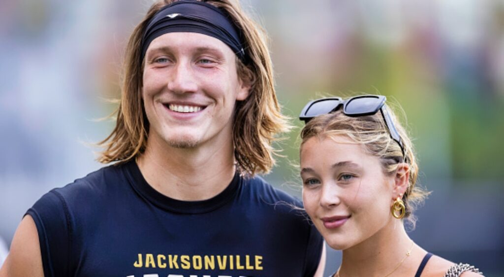 Trevor Lawrence and his wife Marissa pose together at training camp.