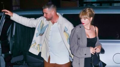 Travis Kelce and Taylor Swift getting out of a car