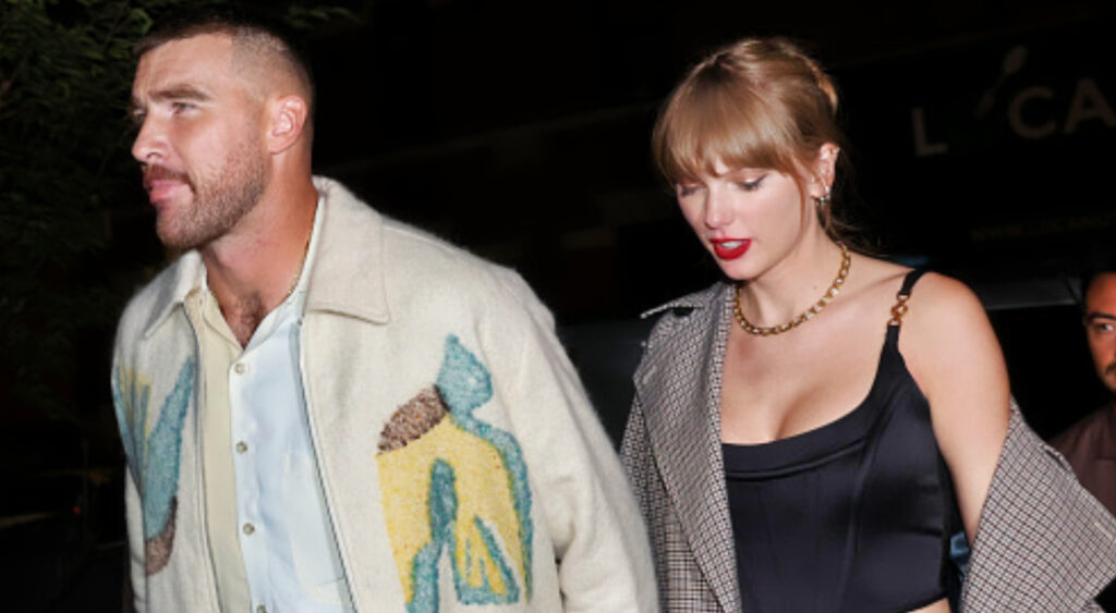 Travis Kelce walking with Taylor Swift