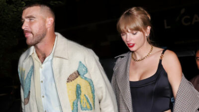 Travis Kelce walking with Taylor Swift
