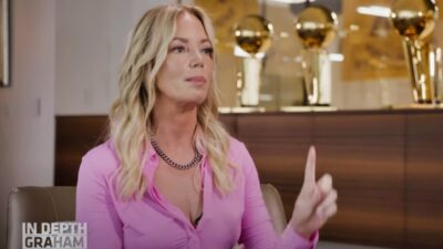 Jeanie Buss in pink shirt during interview