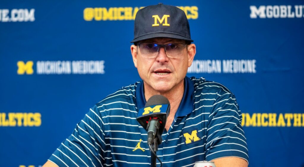 Jim Harbaugh speaks at a press conference