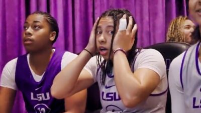 LSU basketball player with hands on head