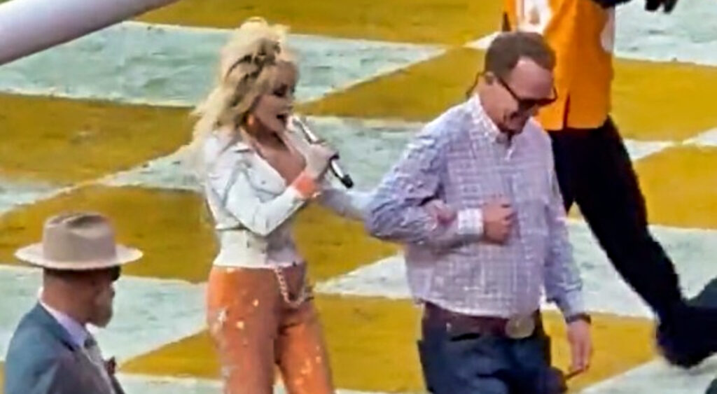 Photos of Dolly Parton and Peyton Manning walking together