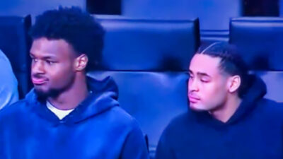 Photo of Bronny James sitting next to a friend at Lakers game