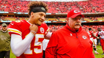 Patrick Mahomes standing next to Andy Reid