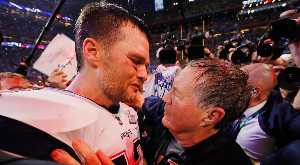 Bill Belichick and Tom Brady embracing each other.