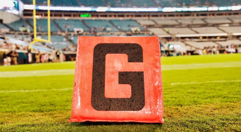 The goal line marker on the field.