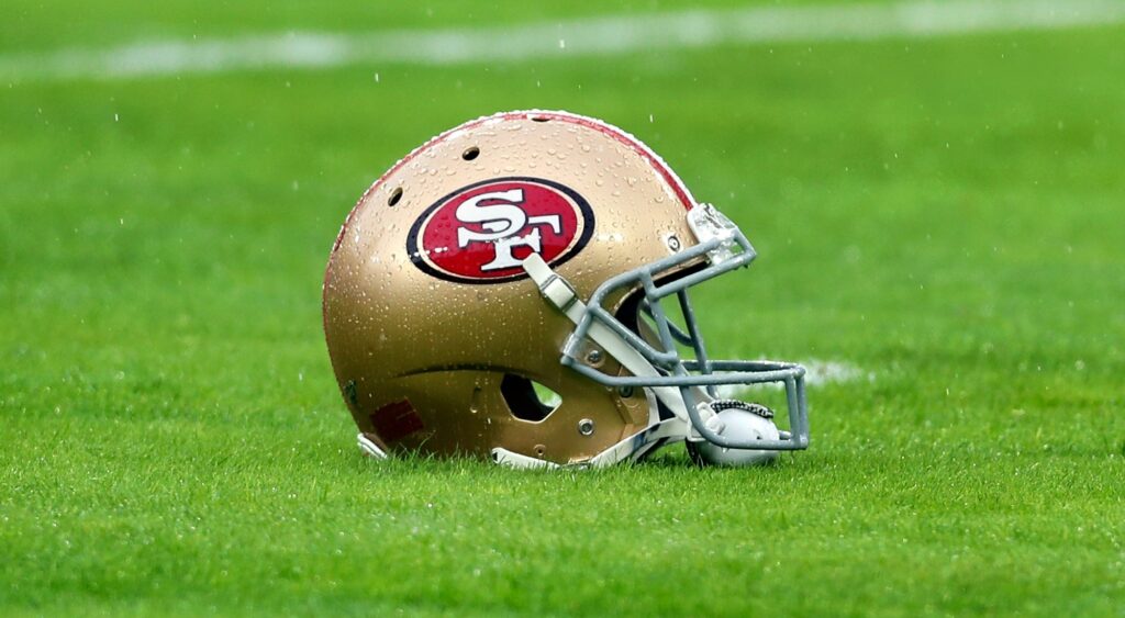 San Francisco 49ers helmet shown on field.