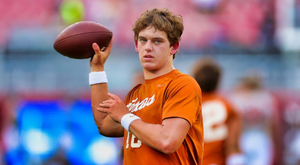 Arch Manning of Texas Longhorns warming up.