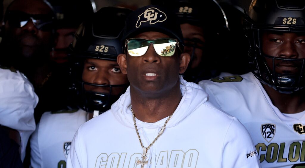 Deion Sanders and players in tunnel