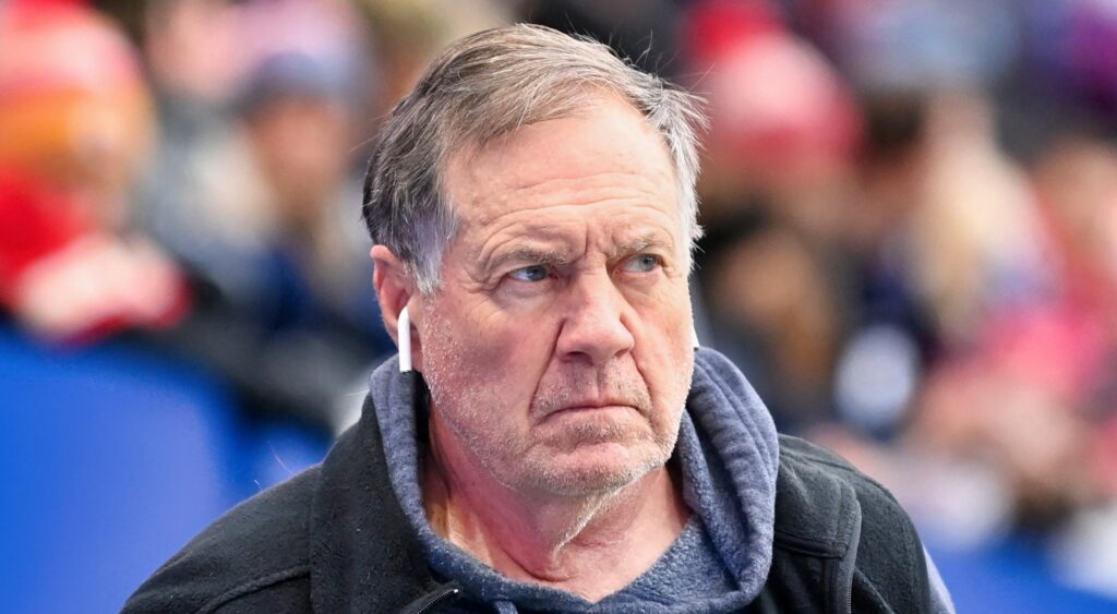 New England Patriots head coach Bill Belichick looking on.