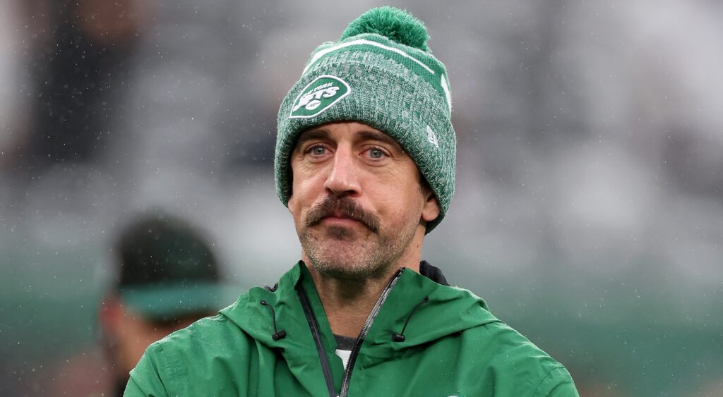Aaron Rodgers of New York Jets looking on.