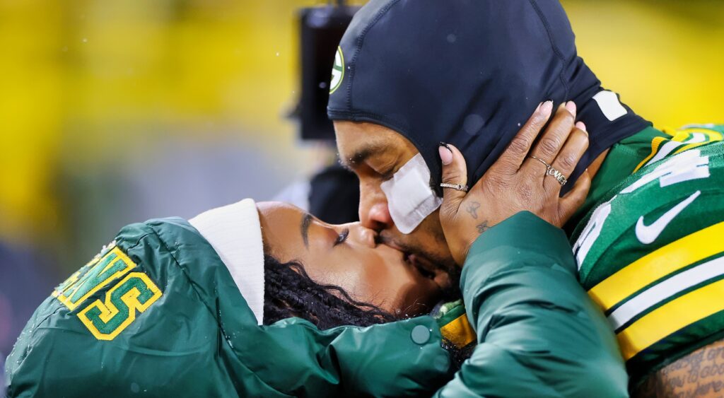 Simone Biles kisses husband Jonathan Owens before a game.