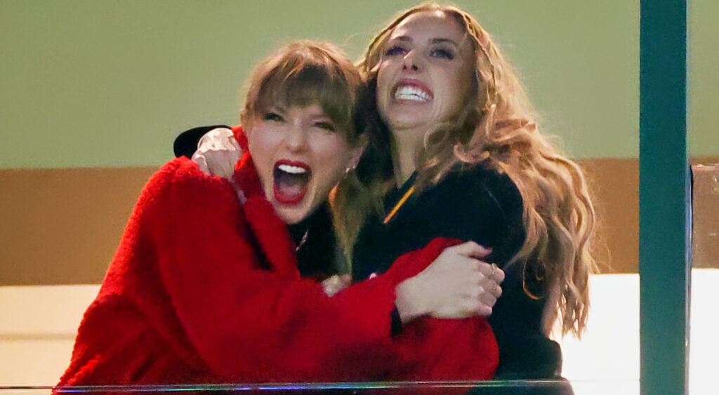 Taylor Swift and Brittany Mahomes holding each other
