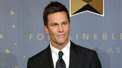 Tom Brady posing in suit