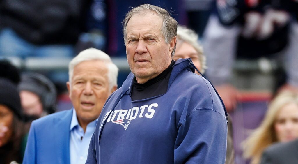 New England Patriots owner Robert Kraft (left) looking on behind Bill Belichick (right).