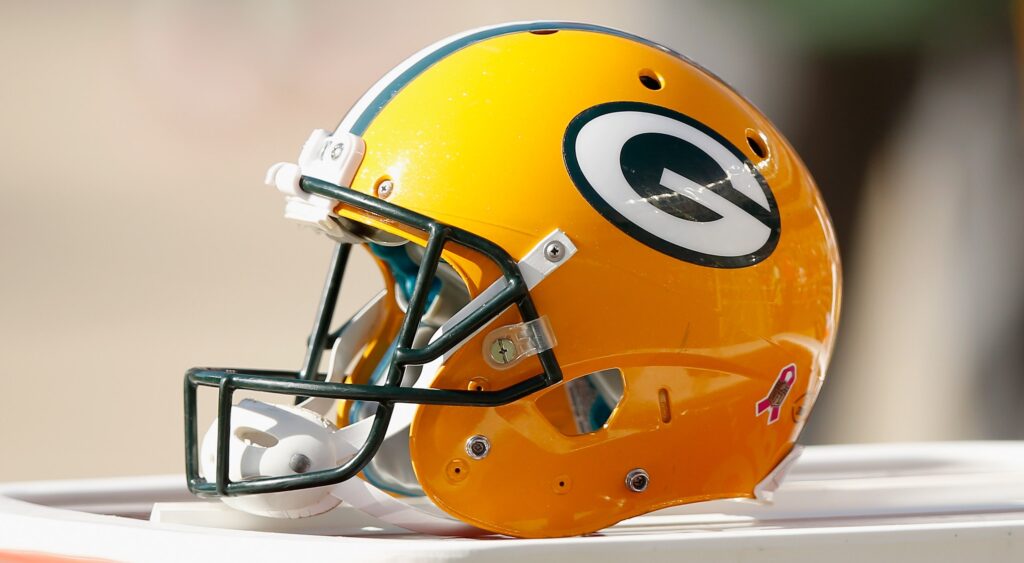 Green Bay Packers helmet shown.