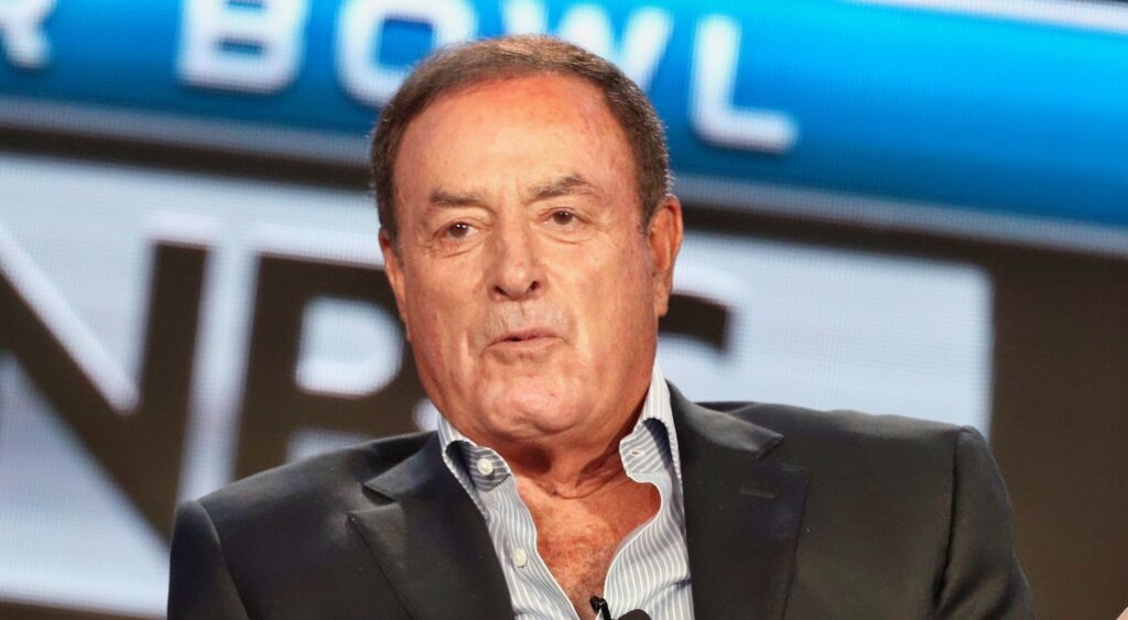 Al Michaels speaking at conference.