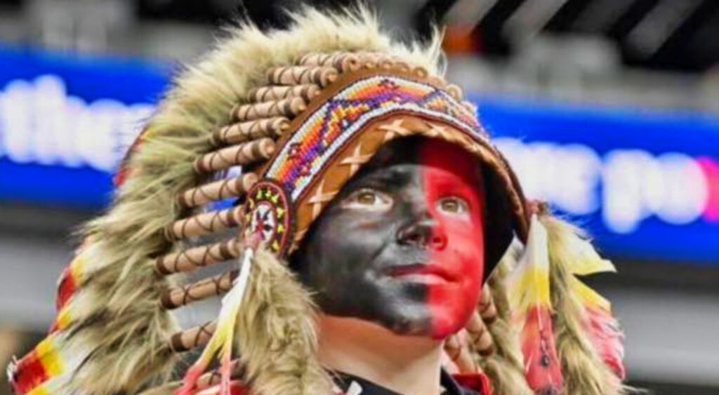 Young Chiefs fan Holden Armenta in face paint and headdress