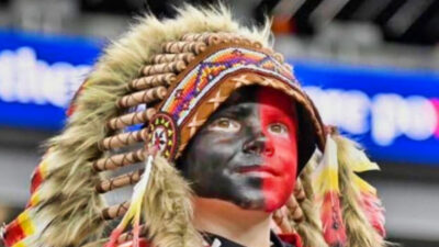 Young Chiefs fan Holden Armenta in face paint and headdress