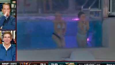 Peyton Manning and Eli looking at women in pool