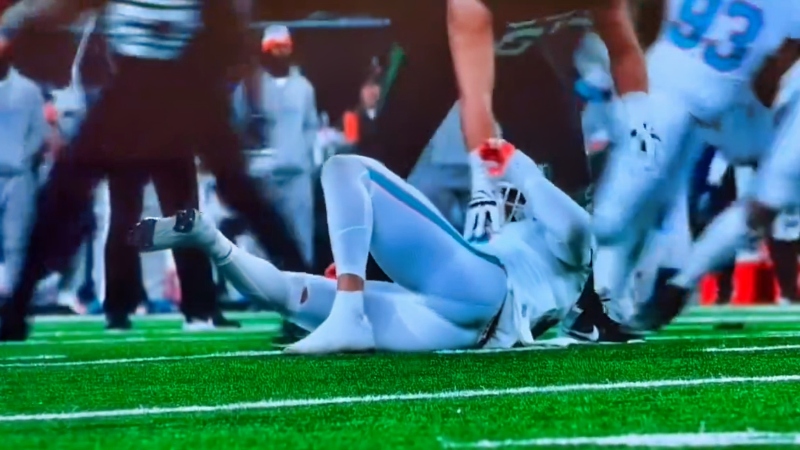 Jaelan Phillips of Miami Dolphins on field after injury.