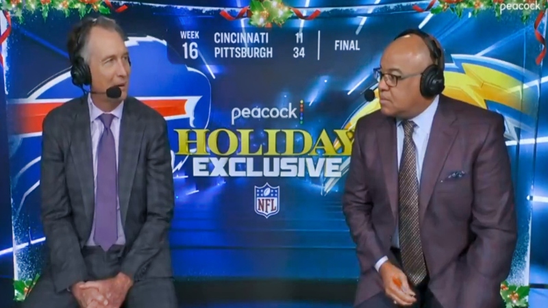 Cris Collinsworth (left) speaking to Mike Tirico (right).