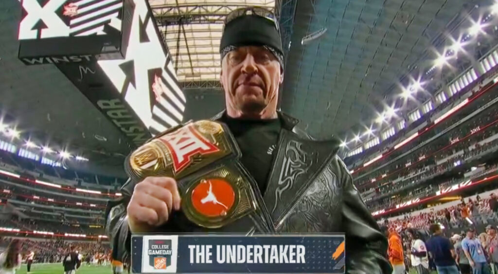 The Undertaker holding Big 12 Championship belt