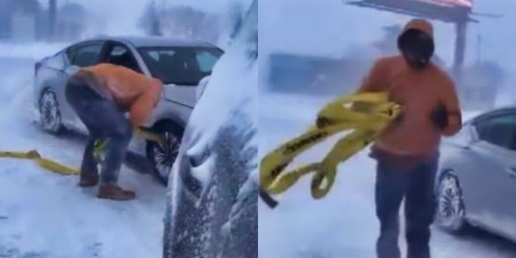 Alec Anderson helping stranded driver in snow