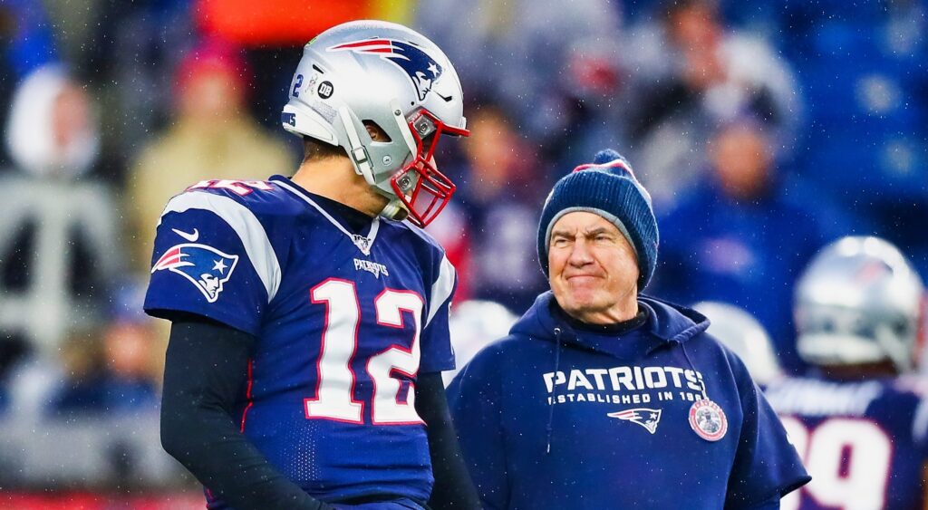 Tom Brady (left) and Bill Belichick (right) looking on.