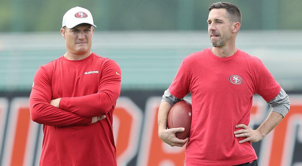 Kyle Shanahan and John Lynch standing side by side