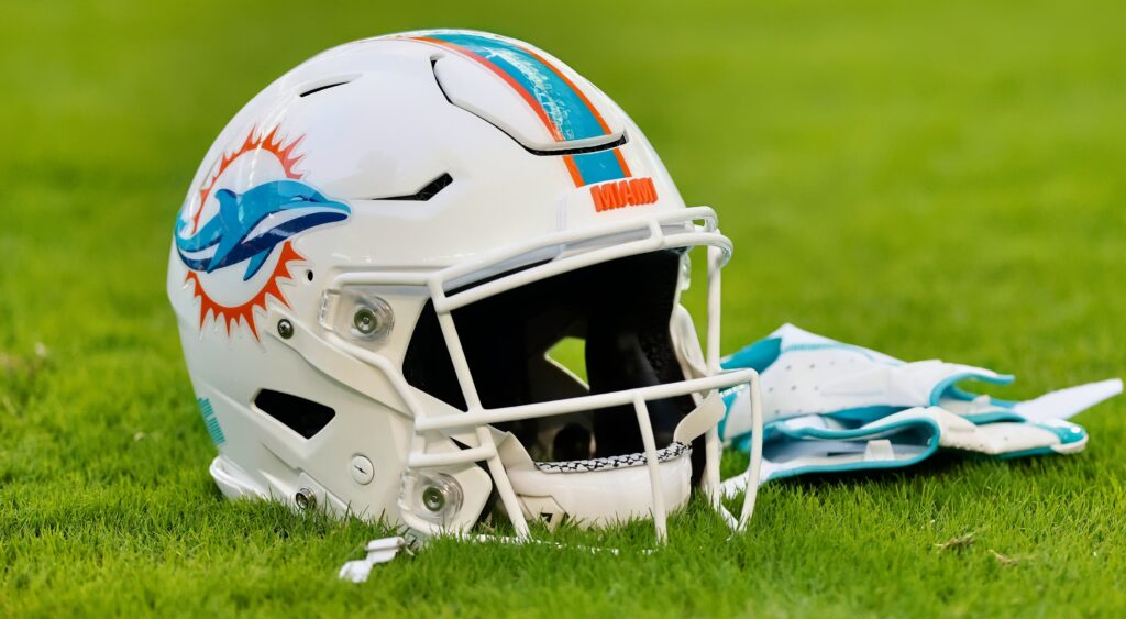 Miami Dolphins helmet shown on turf.