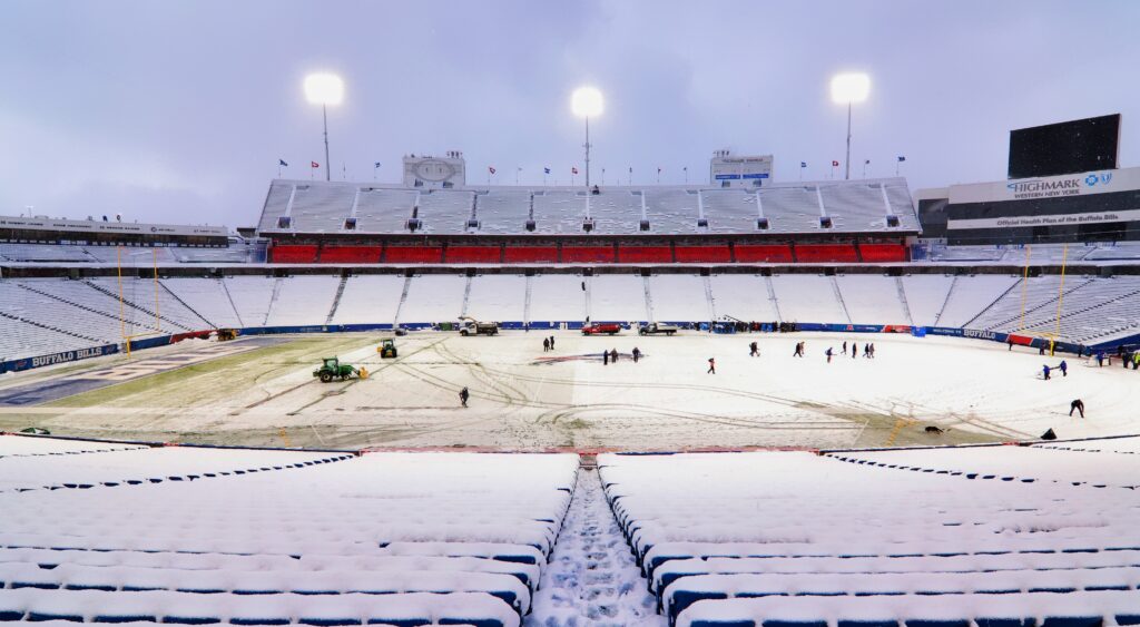 Workers at Buffalo Bills' stadium clearing out snow.