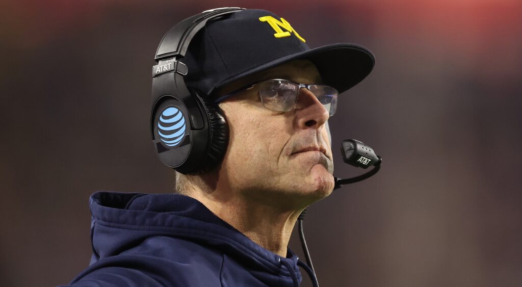Jim Harbaugh with headset on.